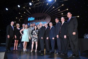 Champion Heating and Cooling group receiving the HVAC Vendor of the Year from WinSupply.