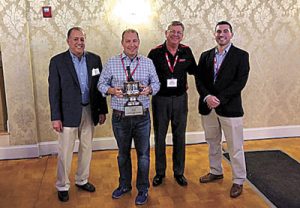 J&J Heating and Air Conditioning Receiving the 2017 Amana Dealer of the Year Award. David Martin, Eric Kline of J&J Heating & Air Conditioning, Jim Barney, and George Maris.
