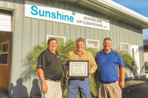Danny O’Bannon (c.) of Sunshine Heating & Air Conditioning with FCS Territory Manager Dennis Marczak and Baker Distributing Regional Manager Jason Gore.