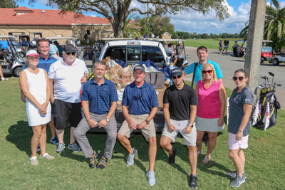 Some of the Trane hosts with the donated food items: Bethany Park, John Weber, Randy Reno, John Jensen, John Higgins, Dan Smith, Susan Rivera, Dennis Haggerty and Heather Fox