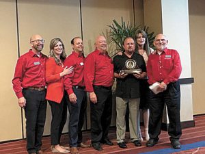 Keith Reynaud receiving the Pioneer Award.