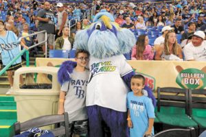 Ethan and Malachi Morales of Amen AC with Rays mascot Raymond.