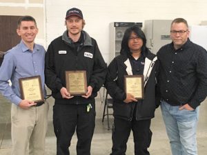 Frigi-Temp employees Frederik Gaube-Ogle (2nd from left) and Cyrus Jovar (2nd from rt.) takes 1st and 2nd place.