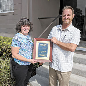 2020 CJ Dillard Award recipient Paula DeSantis-Tarris accepts the award from 2020-2021 RACCA President Bryan Wade.