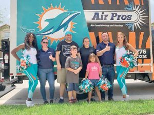 Miami Dolphins cheerleaders, Air Pro representatives and the April and Dustin Sulwer family