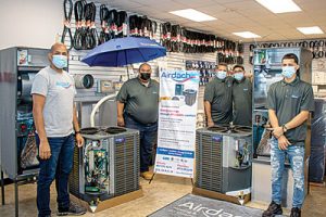 Javier Angulo, José Mussenden Cruz, Jesus Quiles, Luis Rivera and Anthony Diaz of Oldach Kissimmee with the Airdach equipment display