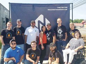 Alicia Reagan (R) with employees of Neal’s Heating & Air Conditioning